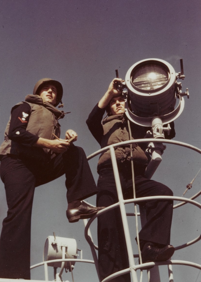 USCGC CAMPBELL (WPG-32). Crewmen signal with a blinker lamp, 1943
