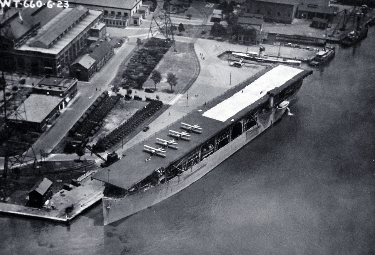 80-G-185894:   USS Langley (CV-1), 1923.  Aerial view while at the Washington Navy Yard, Washington, D.C.  July 3, 1923. Note, Willard Park and Bldg 76 (top center), the current location of the National Museum of the U.S. Navy.  U.S. Navy photograph, now in the collections of the National Archives.  (2015/12/22). 