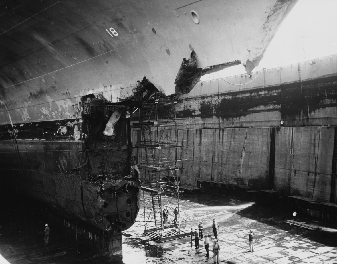 A damaged ship in dry dock.