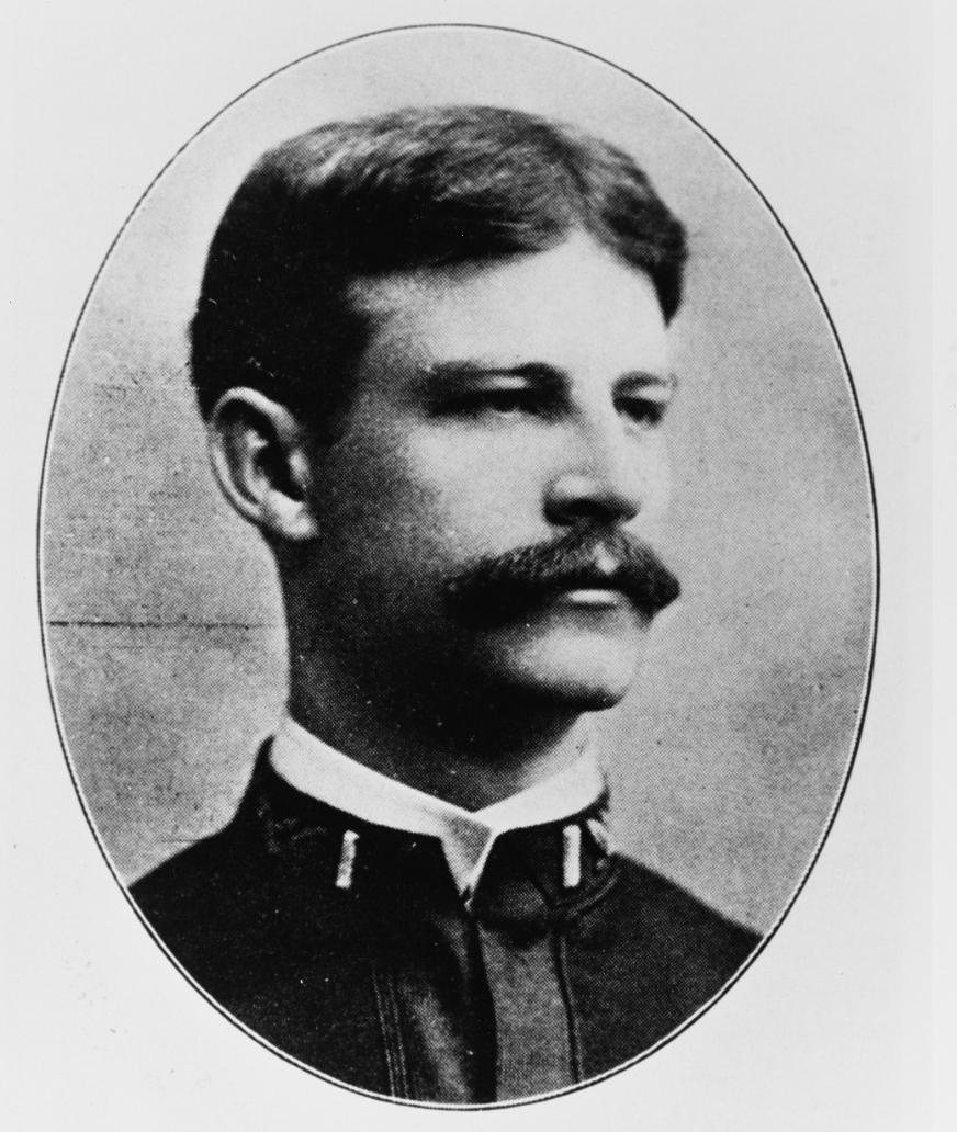 Black and white portrait of a white man in naval officer uniform
