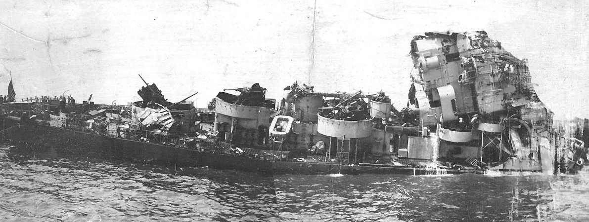 Damaged ship in water. 