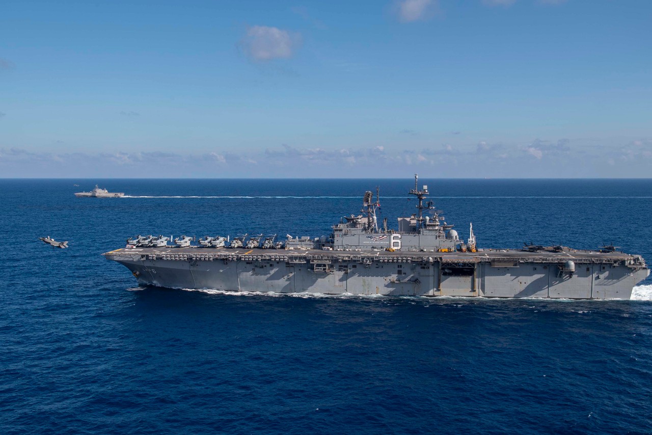 200313-N-FA868-1353 SOUTH CHINA SEA (March 13:: 2020) The amphibious assault ship USS America (LHA 6) is underway alongside the littoral combat ship USS Gabrielle Giffords (LCS 10). America:: flagship of the America Expeditionary Strike Group:: 3...