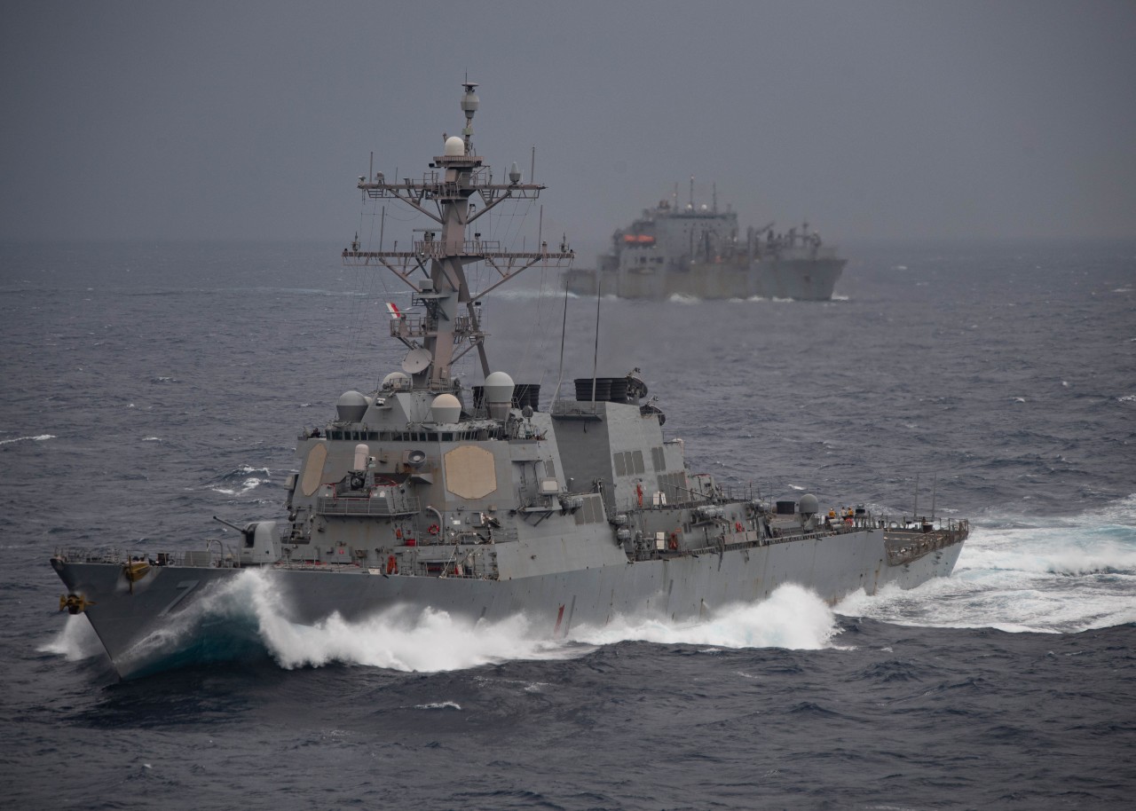 SOUTH CHINA SEA (Jan. 13, 2022) The guided-missile destroyer USS O’Kane (DDG 77), front, and the dry cargo and ammunition ship USNS Alan Sheppard (T-AKE 3) transit the South China Sea with the amphibious assault ship USS Essex (LHD 2), Jan. 13. J...