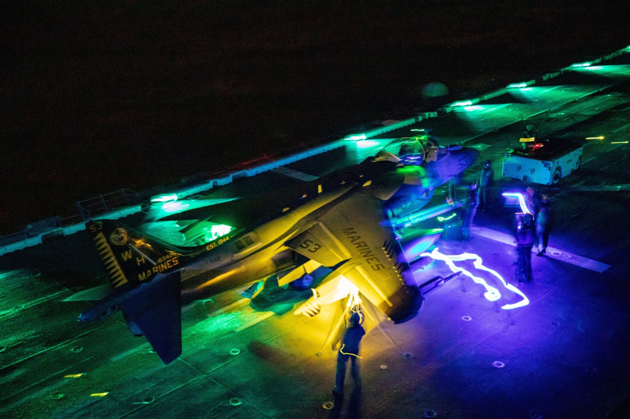 ATLANTIC OCEAN (Jan. 30, 2022) Sailors conduct post-flight checks on a AV-8B Harrier during a composite training unit exercise (COMPTUEX) aboard the amphibious assault ship USS Kearsarge (LHD 3), Jan 30, 2022. The 22nd Marine Expeditionary Unit (...