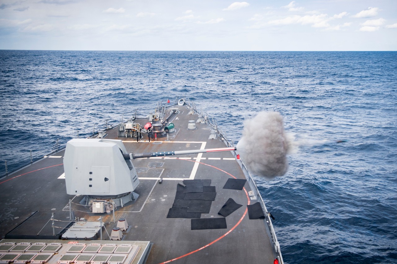 PHILIPPINE SEA (Jan. 7, 2022) The Arleigh Burke-class guided-missile destroyer USS Dewey (DDG 105) fires its Mark 45 5-inch gun during a live-fire training exercise. Dewey is assigned to Destroyer Squadron (DESRON) 15 and is underway supporting a...