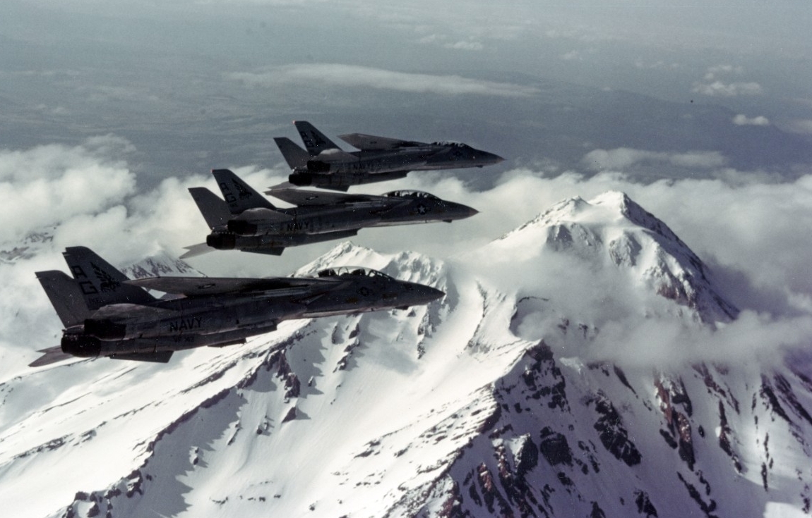 Three F-14A "TOMCAT" Fighters, of VF-143, in flight over Mount Shasta, California, in May 1981