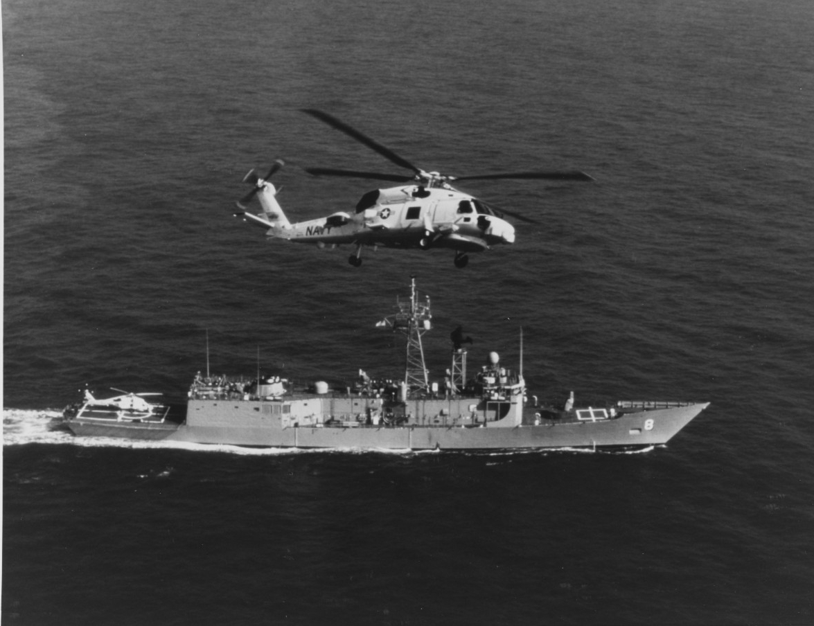 SIKORSKI SH-60B "SEAHAWK" Helicopter in flight over USS MCINERNY (FFG-8), in March 1981