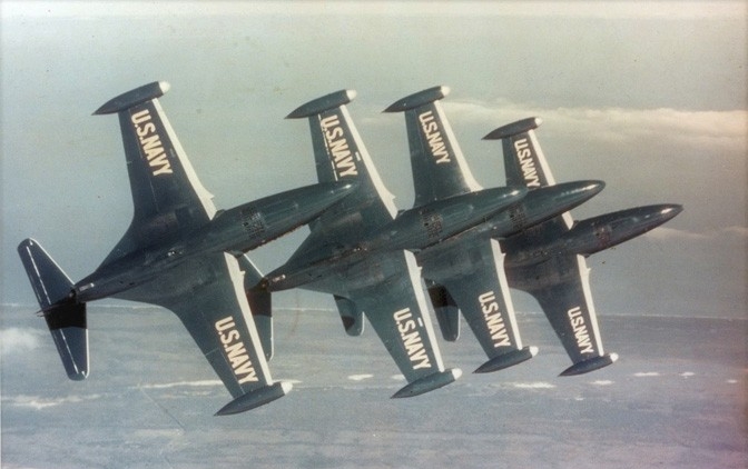 Four Blue Angels F9F Panther jets in flight