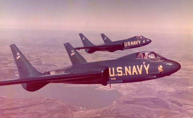 Two Blue Angels F7U Cutlass jets in flight