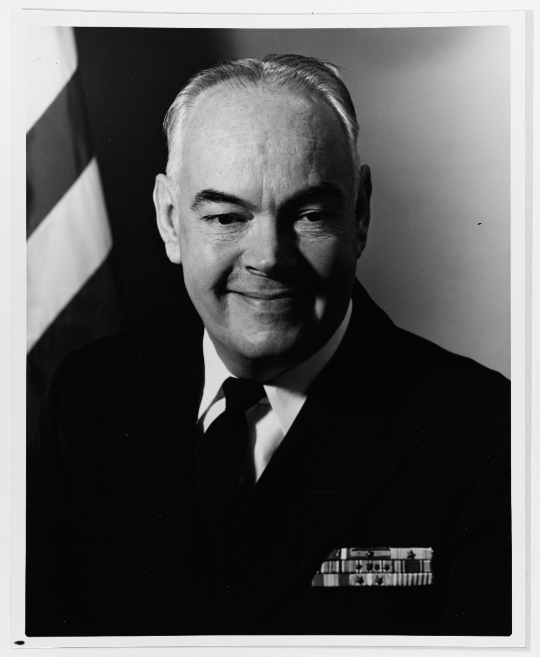 photo of man in Navy uniform smiling