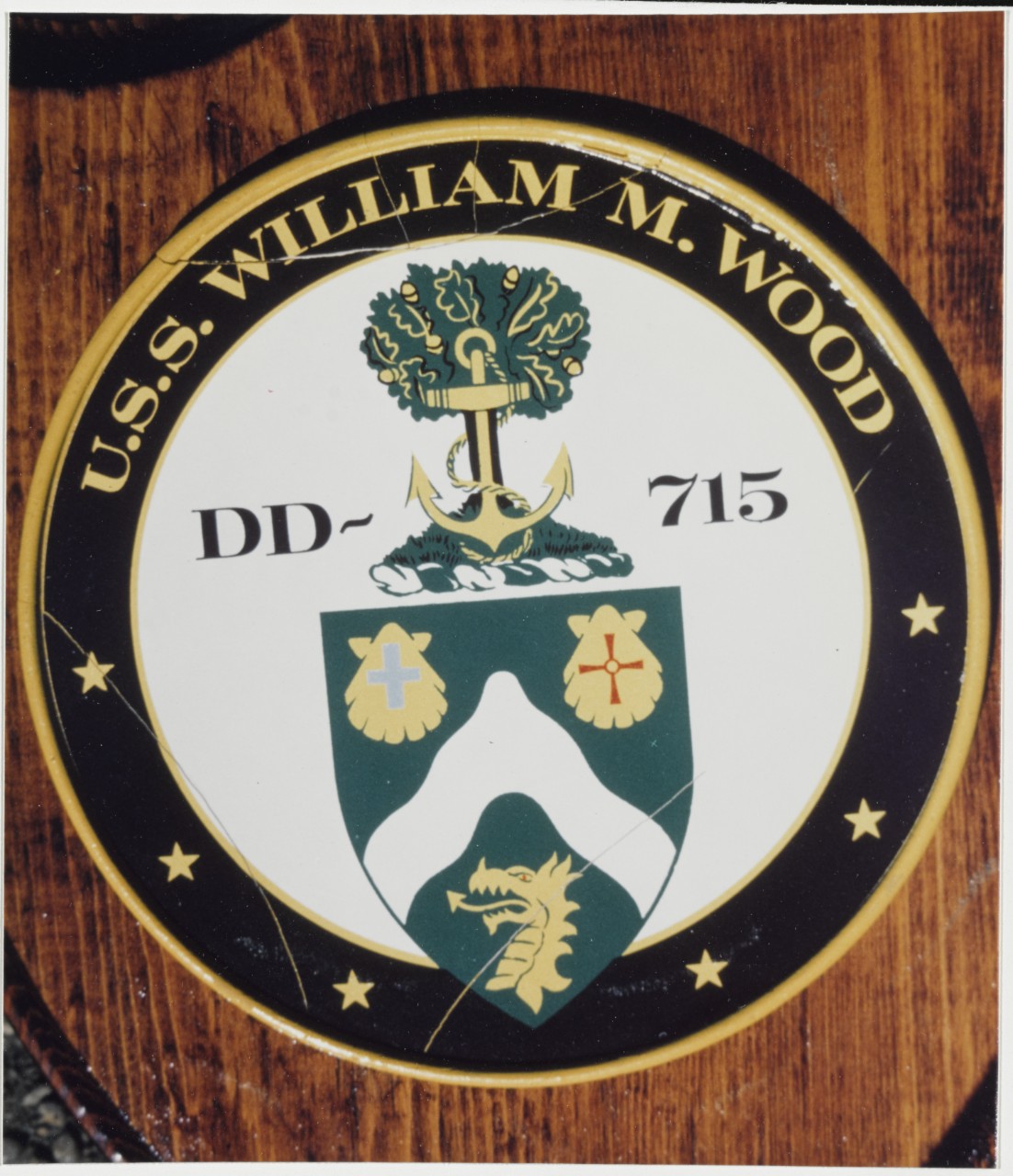 insignia of UUS William M. Wood (DD-715) that features an anchor, shells, and a dragon