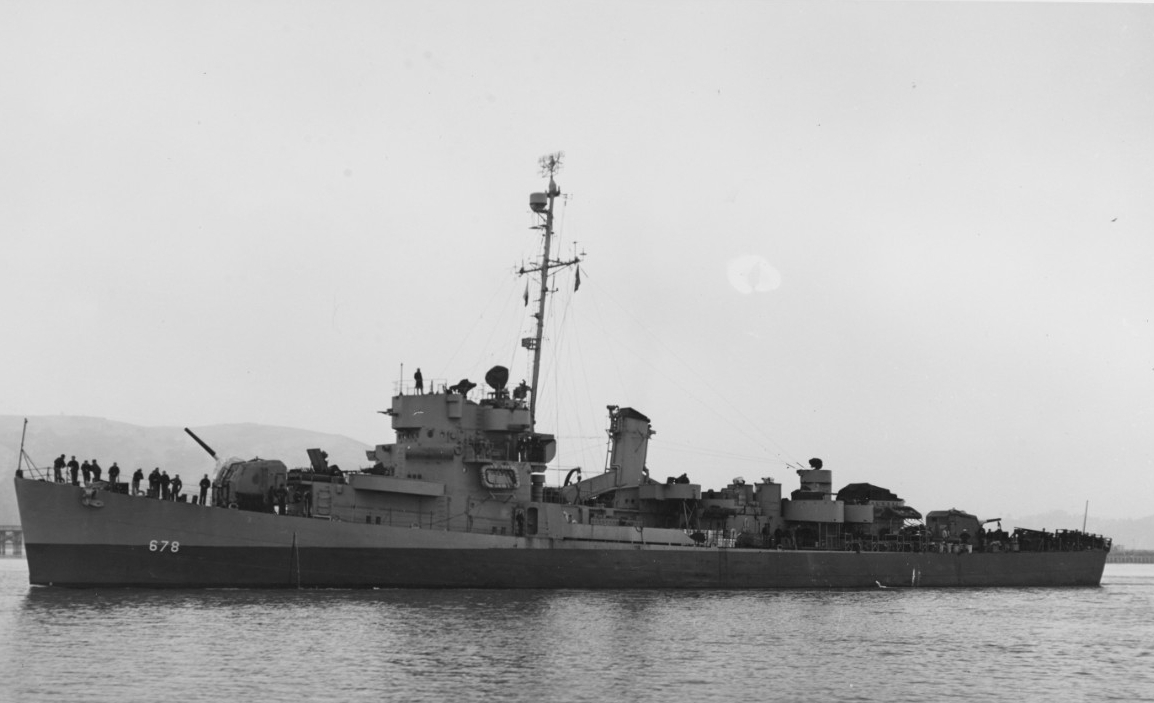 A black-and-white photograph of a Buckley-class destroyer at sea.