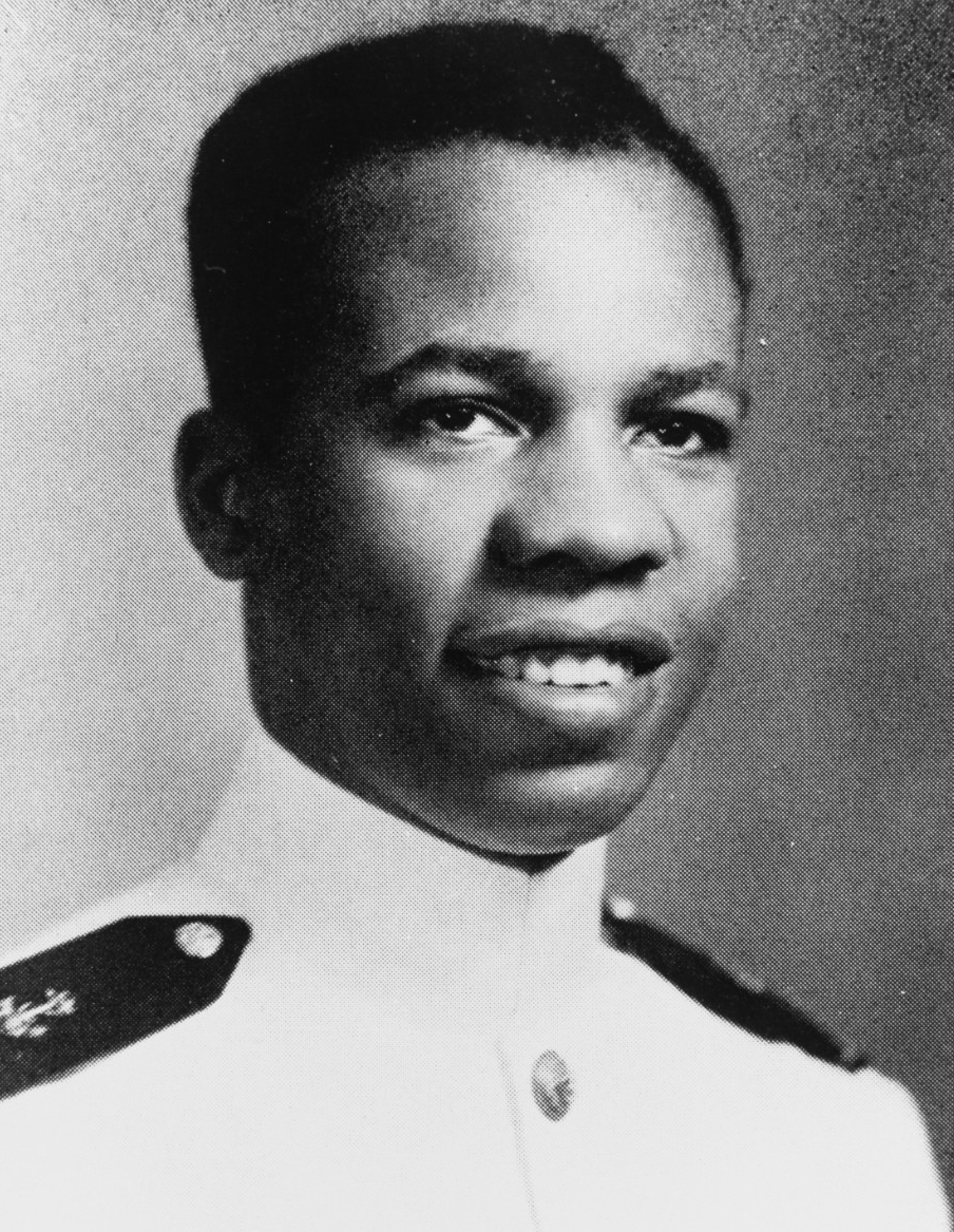 A formal portrait of an African American man in white Navy uniform.