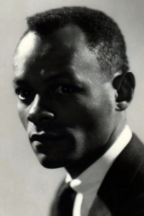 Portrait of a black man in a suit.