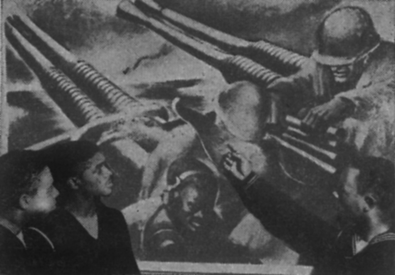 Group portrait of Black sailors looking at a mural.