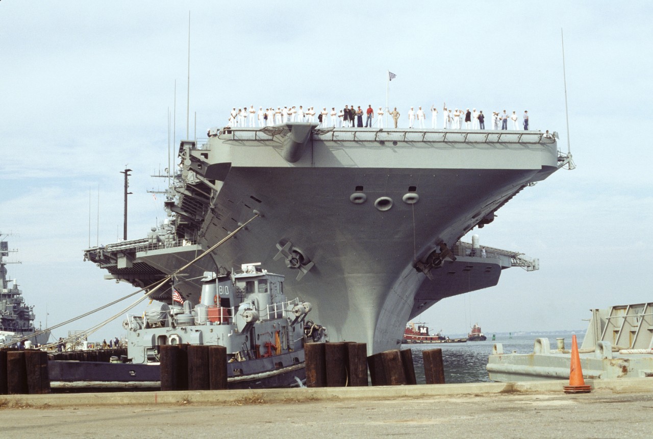Dwight D. Eisenhower (CVN–69), the first combatant ship with a mixed-sex crew, leaving Norfolk, Virginia, for a six-month deployment, 20 October 1994. (National Archives, 6493349)
