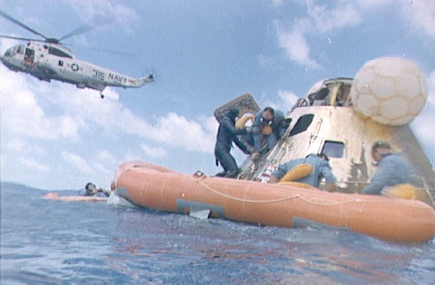 Astronaut Alan Bean assisted with egressing command module after landing