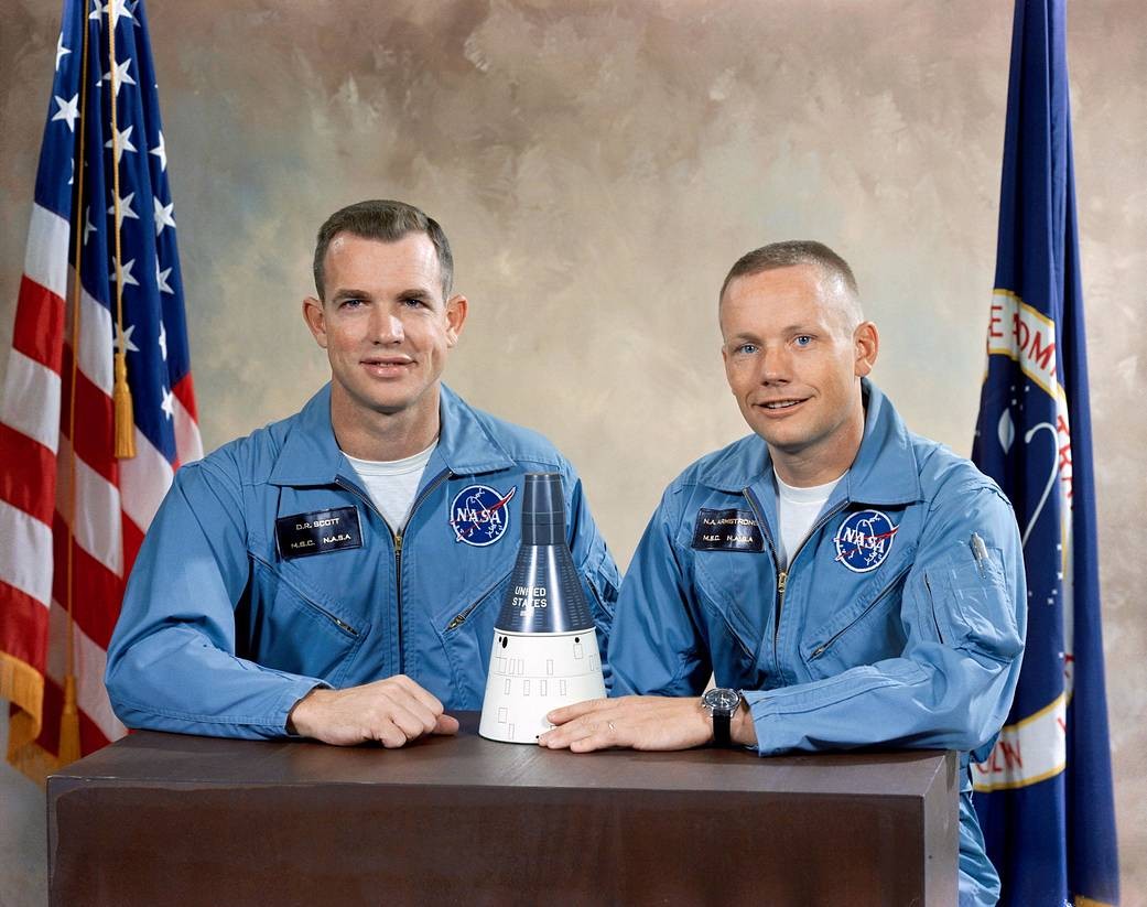 Astronauts David R. Scott (left), Pilot; and, Neil A. Armstrong (right), Command Pilot, pose with model of the Gemini Spacecraft after being selected as the crew for the Gemini VIII mission. (Image Credit: NASA)