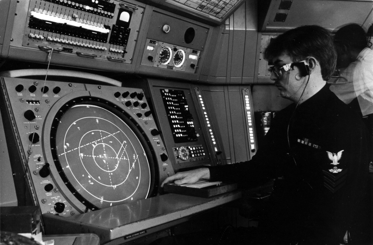 Controlman monitoring a radar console