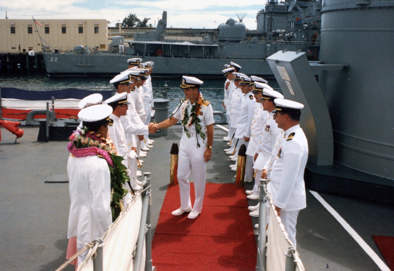 Collection of 47 color photographs related to the change of command onboard USS Goldsborough (DDG-20) at Pearl Harbor, HI, October 9, 1987. The bulk of the imagery shows Commander Melvin Kaahanui relieving Commander Michael Mullen, including spee...