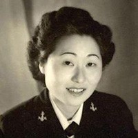 <p>Korean-American woman in naval uniform, no hat.&nbsp;</p>