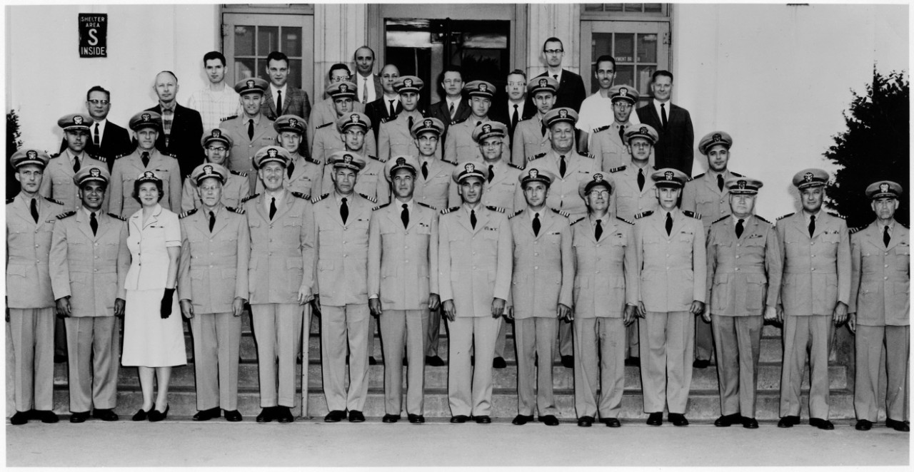 <p>Group portrait of uniformed servicemembers in rows on steps of a building</p>