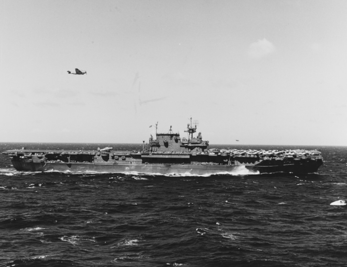 USS Enterprise (CV-6). Landing aircraft while supporting the Gilberts Operation, 22 November 1943. A TBM Avenger torpedo plane is on the flight deck, aft, while another is flying overhead.