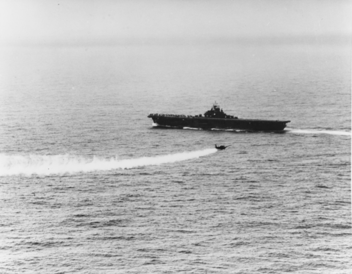 TBM Avenger, trailing smoke, returned to USS Essex (CV-9) 