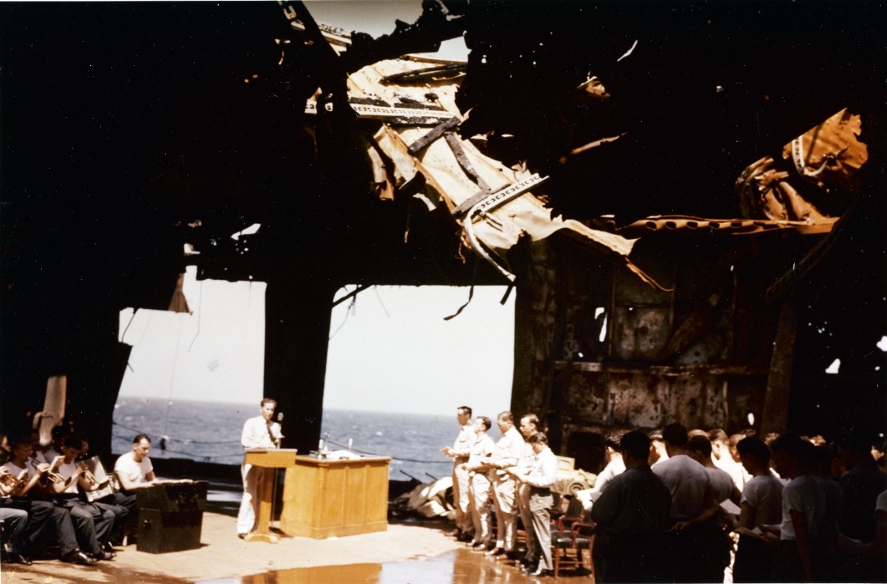 Church service on USS Franklin’s (CV-13) ruined hangar deck