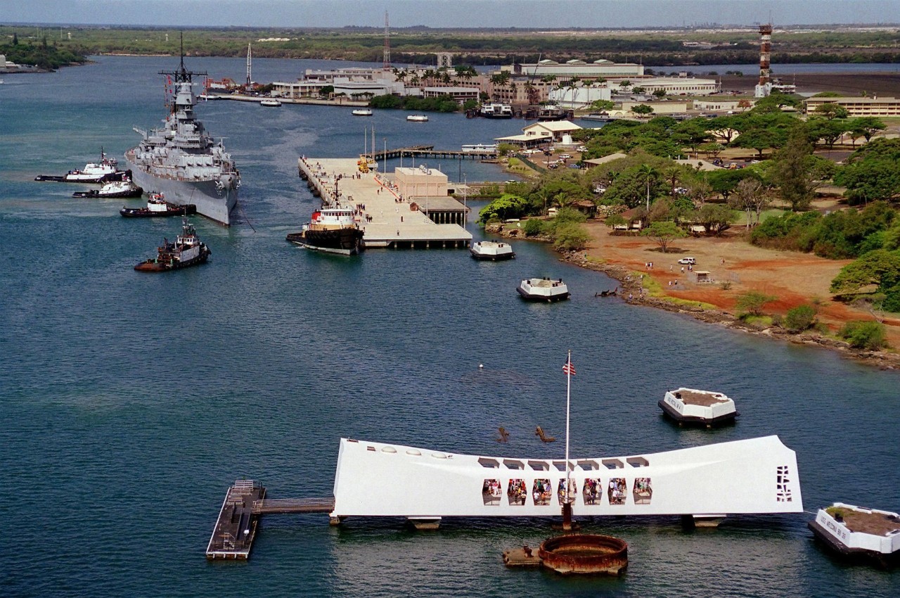 Tugs move USS Missouri (BB-63) to her berth at Ford Island