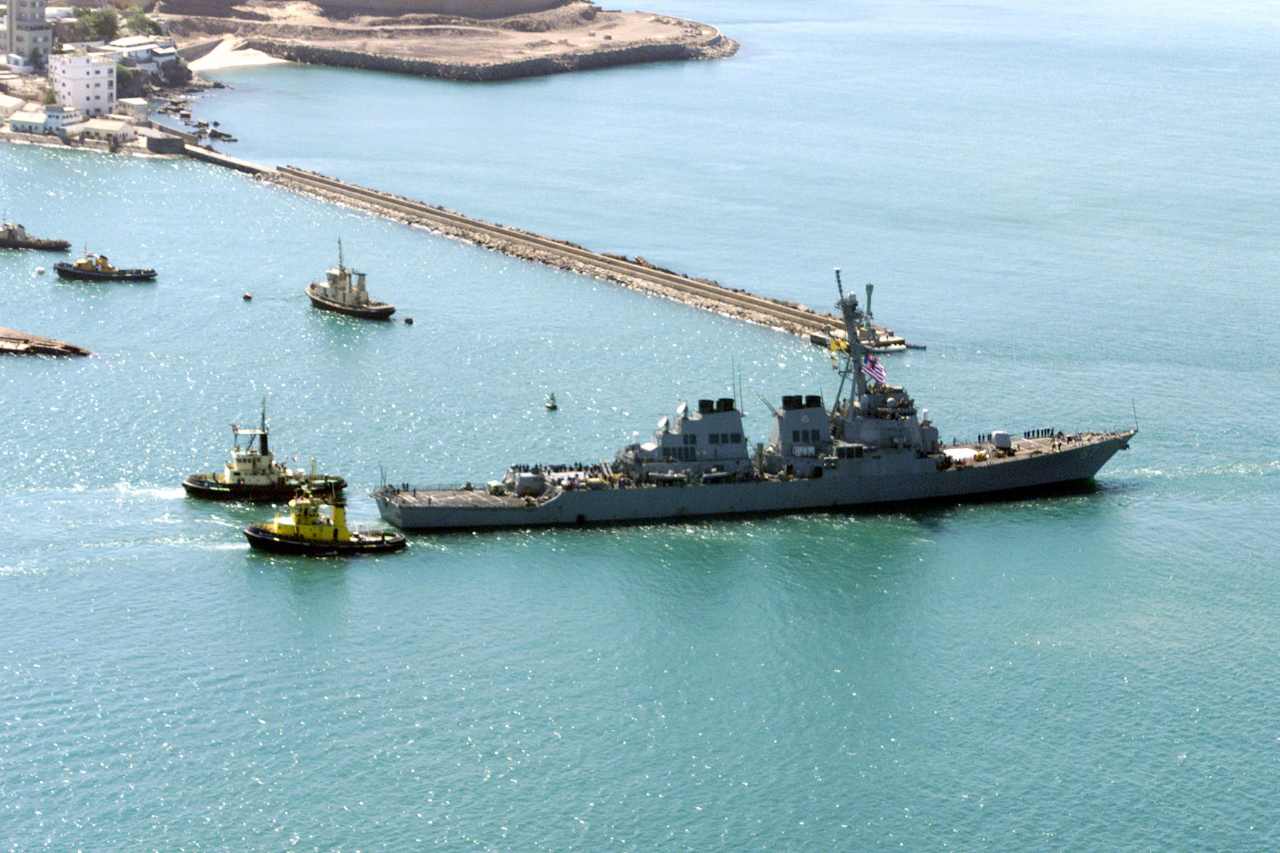 USS Cole (DDG-67) being towed from the Aden harbor, Yemen. (National Archives photo 6612203)