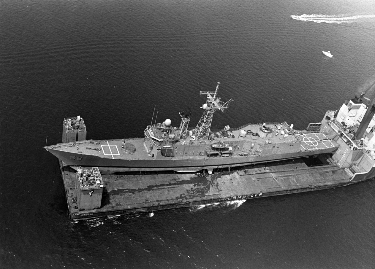An aerial view of USS Samuel B. Roberts (FFG-58) being transported by the Dutch heavy lift ship Might Servant II in Narragansett Bay