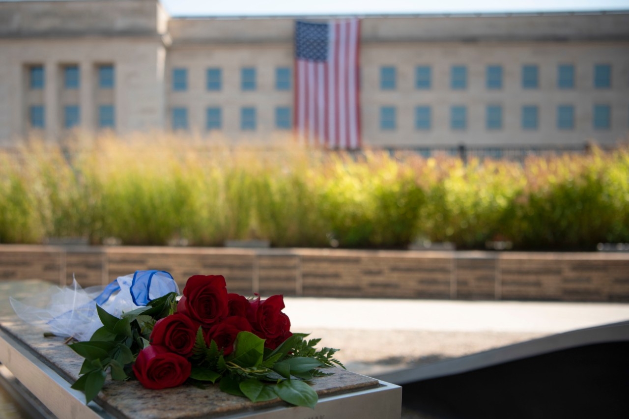 A bouquet lies on a bench at the National 9/11 Pentagon Memorial