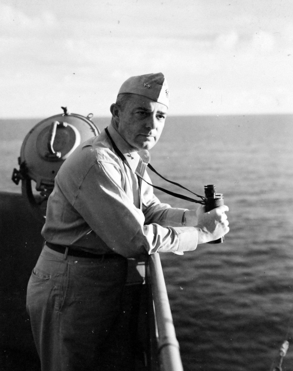 <p>80-G-57537: Battle of Cape Gloucester, New Britain, December 1943-January 1944. Rear Admiral A.S. Merrill, Commander of Task Force 39 onboard USS Montpelier (CL-57), December 1943.&nbsp;</p>
