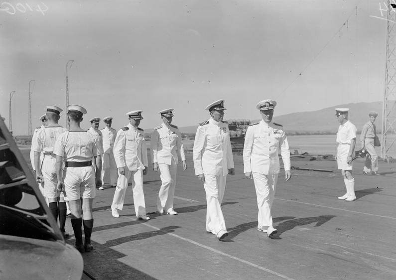<p>Admiral Chester W. Nimitz, USN, accompanied by Captain L. D. Mackintosh, RN, commanding officer of <i>Victorious</i>, during Nimitz’s official visit to the carrier at Pearl Harbor, March 1943&nbsp;</p>
