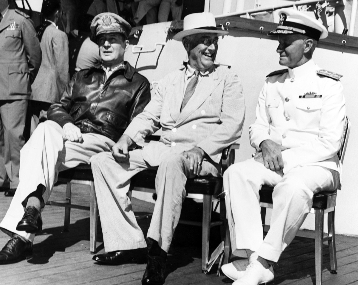 Photo #: 80-G-241479  General Douglas MacArthur, U.S. Army (left); President Franklin D. Roosevelt (center); and Admiral Chester W. Nimitz, USN (right)