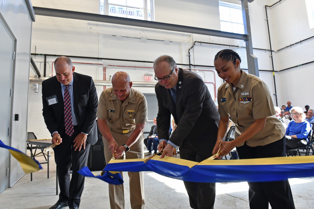 <p>WASHINGTON (August 8, 2022) Chief of Naval Operations Adm. Mike Gilday, center left, Naval History and Heritage Command (NHHC) Director Sam Cox, Yeoman 2nd Class Lynnett Evans, and Kenneth Terry, Vice President and Operations Manager at Grunley Construction Company, cut a ribbon during a ceremony showcasing NHHC’s newest conservation and preservation site. The new state-of-the-art Naval History and Research Center (NHRC) will house NHHC’s Navy Art Collection and Underwater Archeology Branch (UAB) of the Collection Management Division and Histories and Archives Division, including the Navy Library and Archives Branch. (U.S. Navy photo by Arif Patani)</p>
