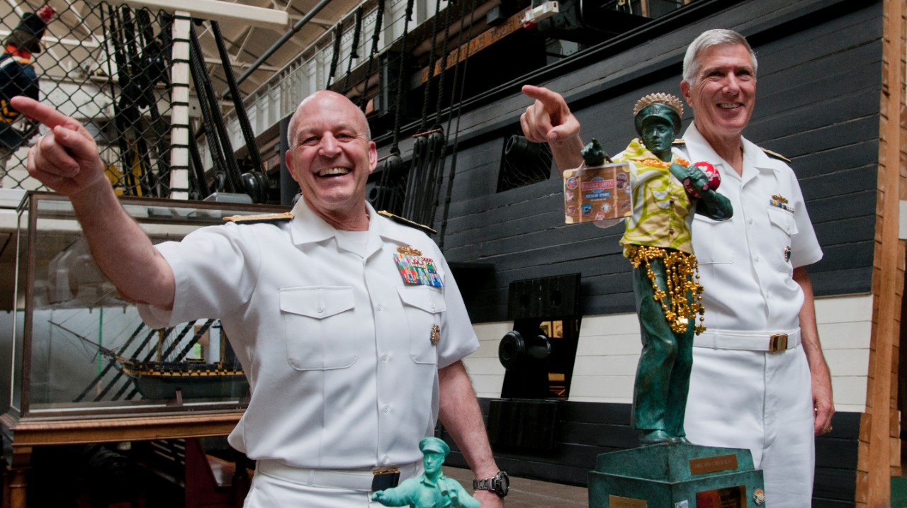 Vice Adm. Michael LeFever and Adm. Samuel Locklear, commander of U.S. Pacific Command, pose in front of the Surface Naval Association 'Old Salt' statue at the National Museum of the United States Navy at the Washington Navy Yard.