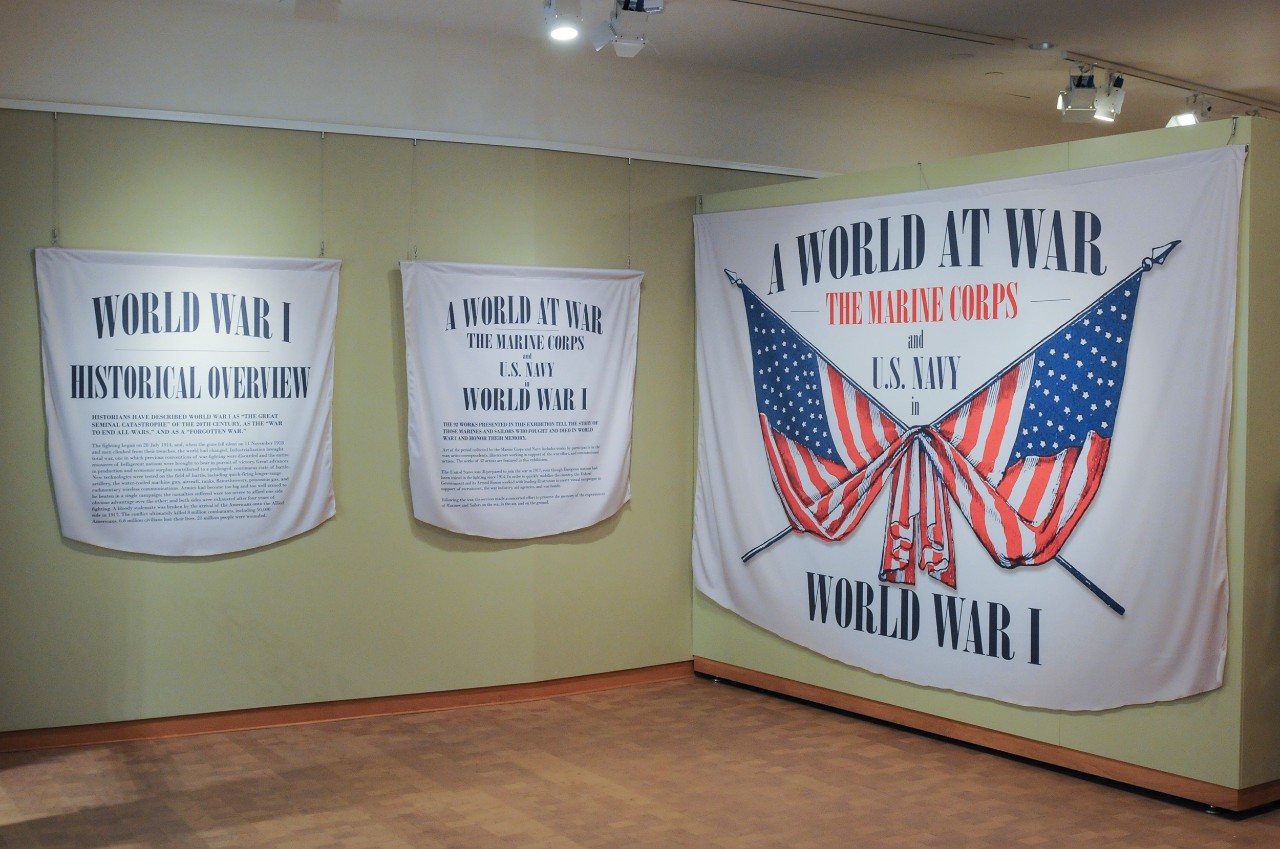 Exhibit banners hang on a wall 