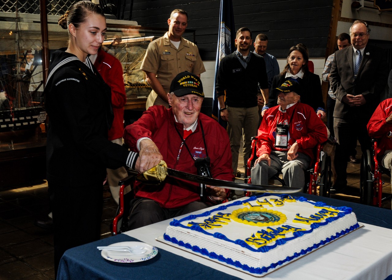 During the 243rd Navy Birthday celebration, the youngest Sailor and the oldest Sailor cut the cake. 