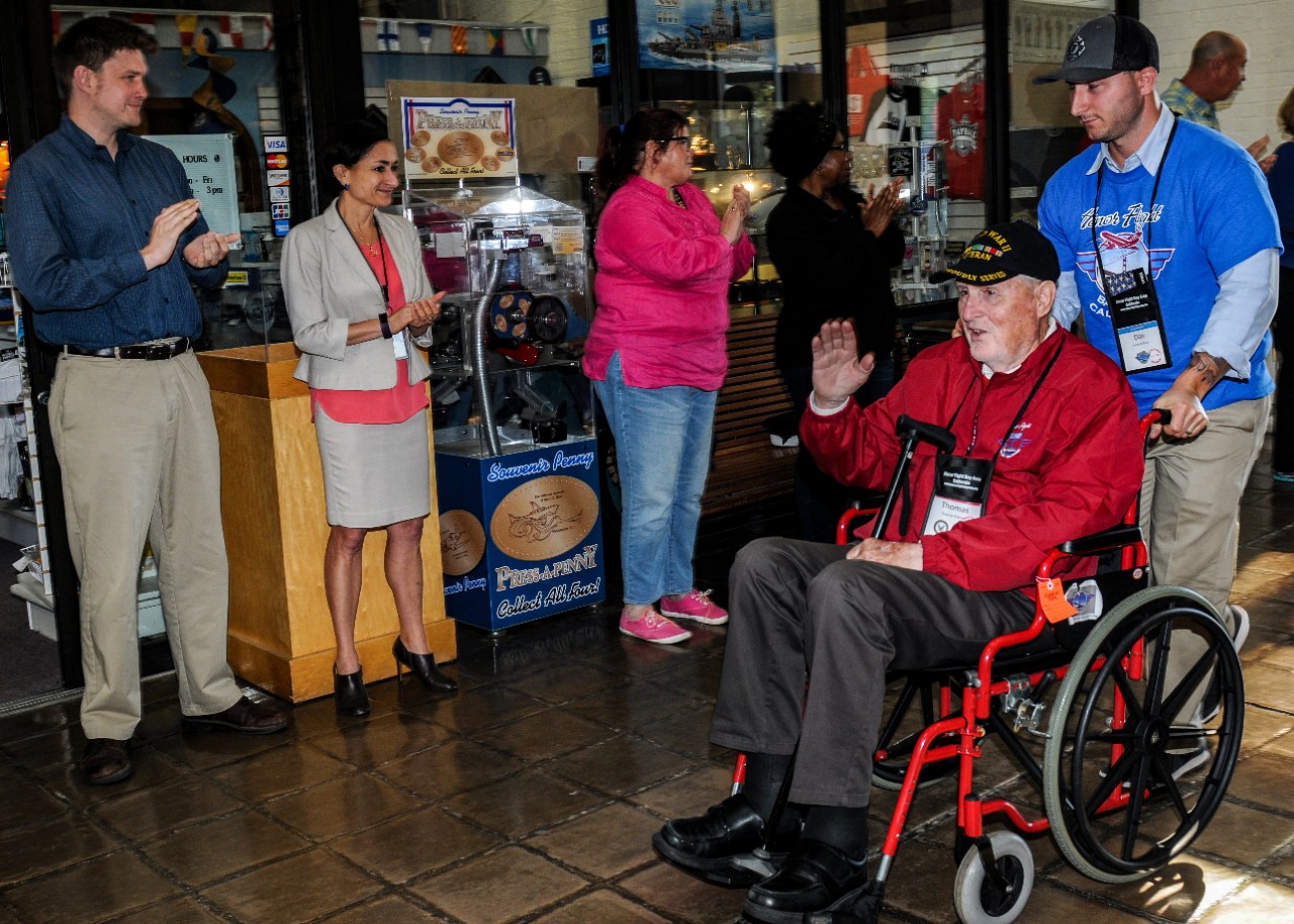 Thomas O'Brien, a World War II veteran, is wheeled into the National Musuem of the U.S. Navy.