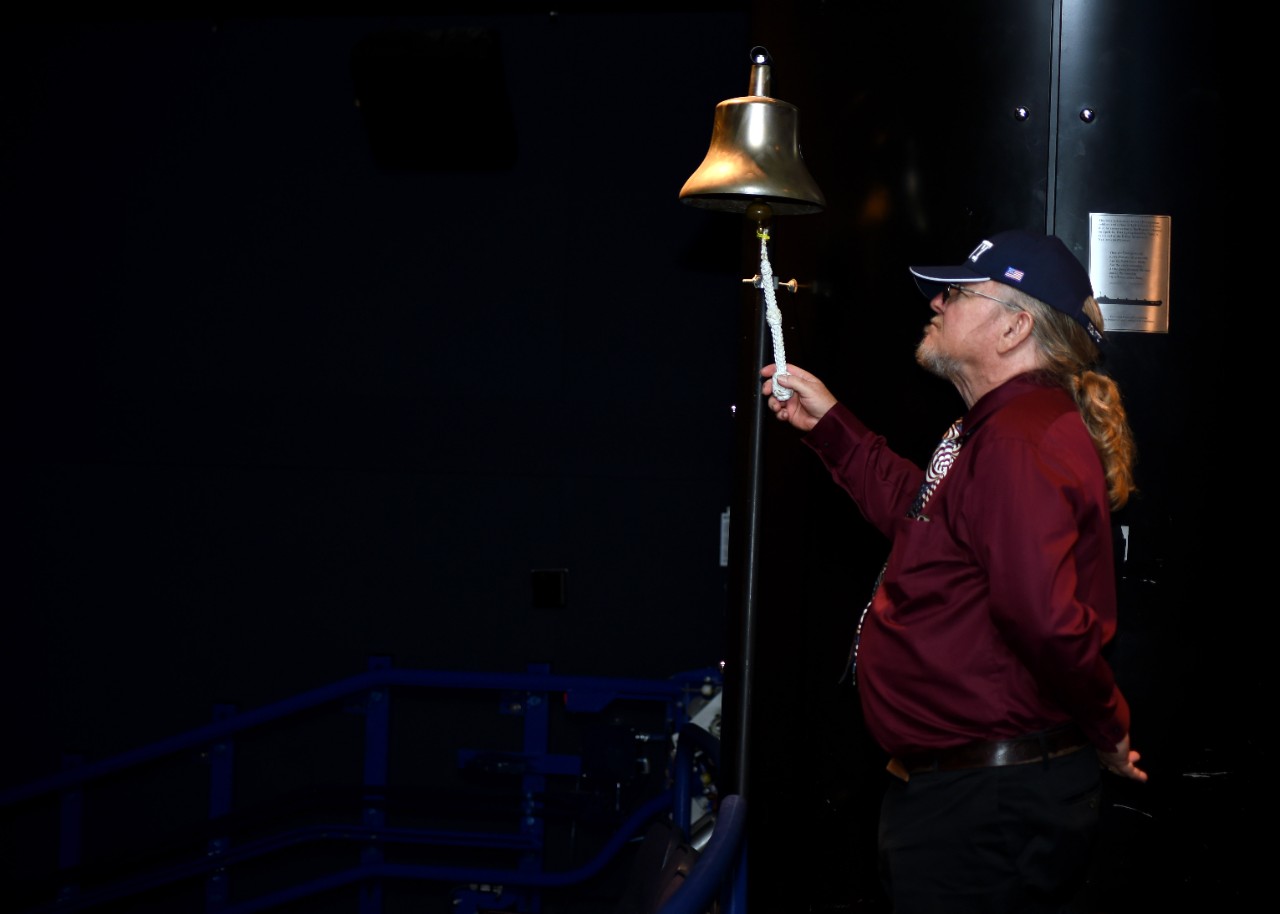 Michael Davis rings a bell at the Navy Memorial
