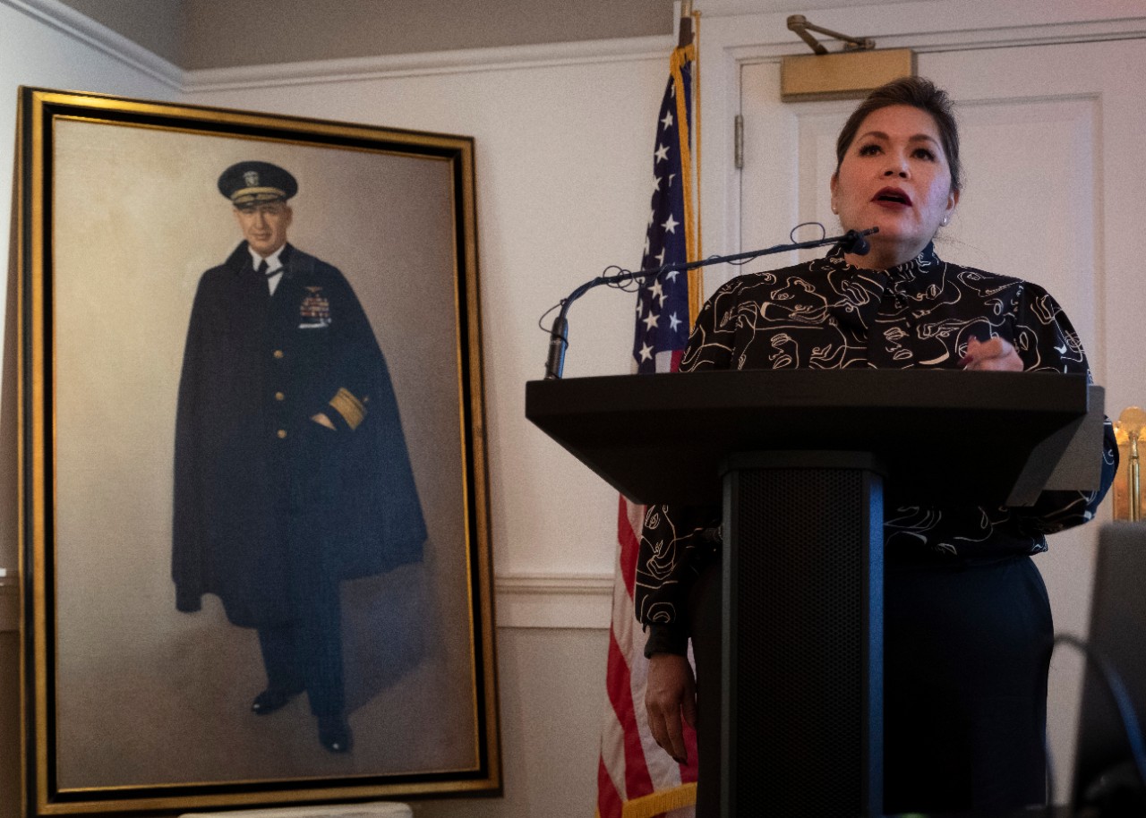 <p>Kimberly Teehee, Cherokee Nation delegate-designate to Congress, speaks about the late Adm. Joseph Clark, a member of the Cherokee Nation and the first Native-American U.S. Naval Academy graduate, during a donation event at the Army and Navy Club (ANC) Washington, D.C., Nov. 12, 2021. Several items cataloging Clark’s accomplishments were recovered and donated to the Clark family, the Cherokee Nation, and ANC, recognizing Clark’s many contributions to Naval Aviation throughout his career. (U.S. Navy photo by Mass Communication Specialist 1st Class Torrey W. Lee)</p>