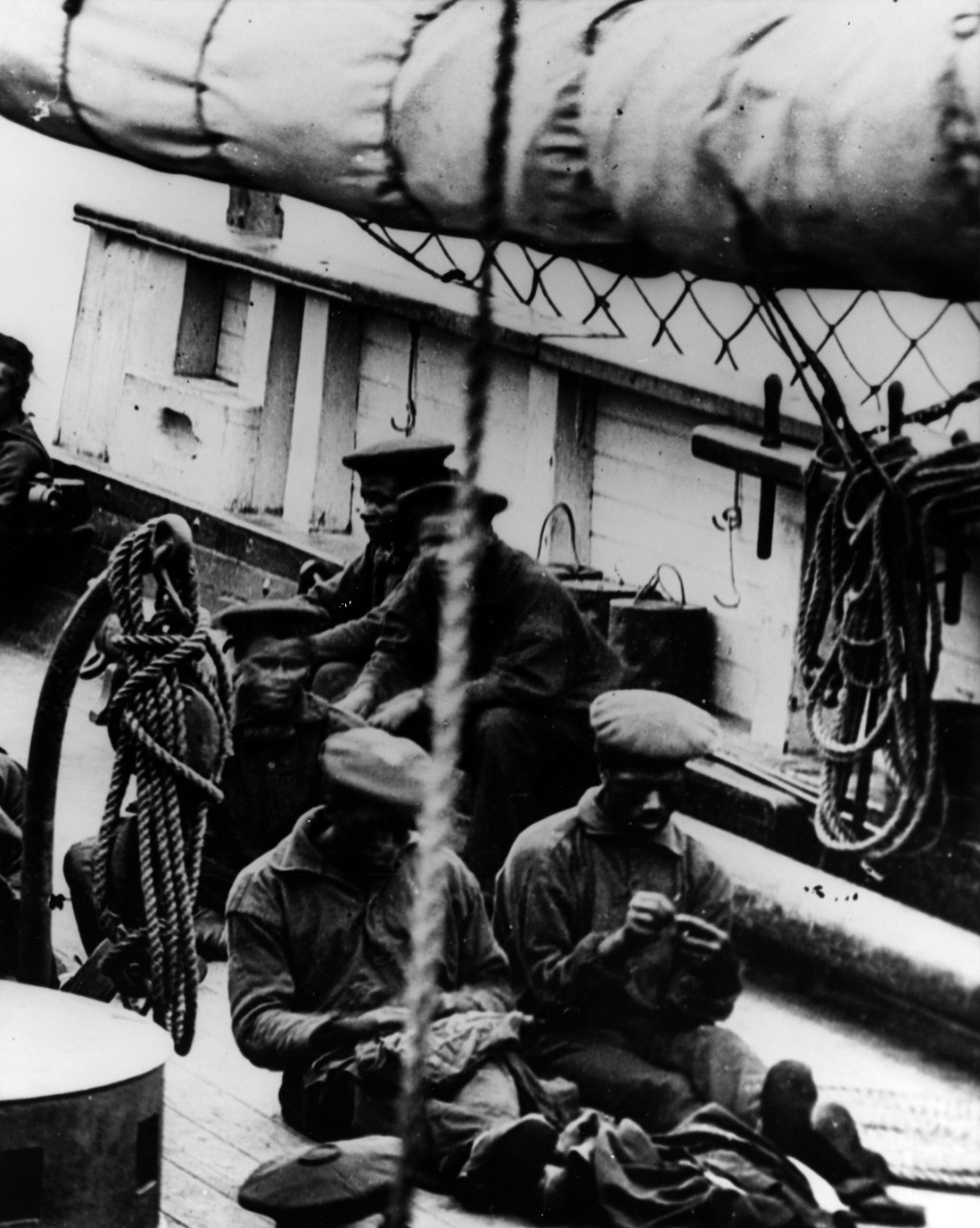 African American crew members sewing and relaxing on the forecastle, starboard side, circa 1864-65