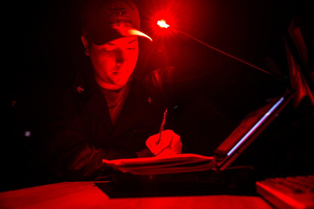 <p>PACIFIC OCEAN (Jan. 1, 2020) Quartermaster 3rd Class Ryan Gouger, from Newberg, Ore., writes the first deck log of the year while standing Quartermaster of the Watch on the bridge of the aircraft carrier USS Abraham Lincoln (CVN 72). The Abraham Lincoln Carrier Strike Group is deployed to the U.S. 7th Fleet area of operations in support of security and stability in the Indo-Pacific region. With Abraham Lincoln as the flagship, deployed strike group assets include staffs and aircraft of Carrier Strike Group (CSG) 12, Destroyer Squadron (DESRON) 2 and Carrier Air Wing (CVW) 7. (U.S. Navy photo by Mass Communication Specialist 3rd Class Dan Snow/Released)</p>