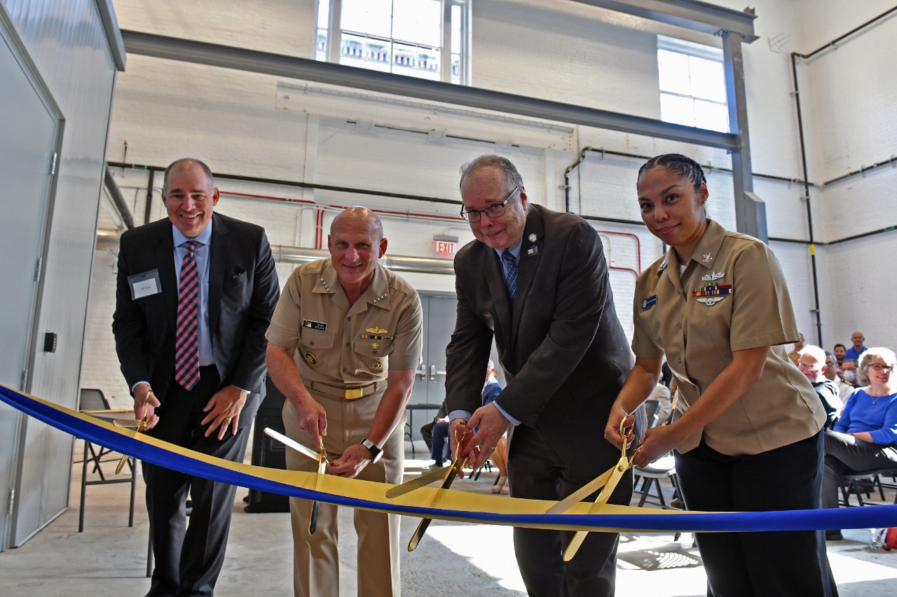 <p>WASHINGTON (August 8, 2022) Chief of Naval Operations Adm. Mike Gilday, center left, Naval History and Heritage Command (NHHC) Director Sam Cox, Yeoman 2nd Class Lynnett Evans, and Kenneth Terry, Vice President and Operations Manager at Grunley Construction Company, cut a ribbon during a ceremony showcasing NHHC’s newest conservation and preservation site. The new state-of-the-art Naval History and Research Center (NHRC) will house NHHC’s Navy Art Collection and Underwater Archeology Branch (UAB) of the Collection Management Division and Histories and Archives Division, including the Navy Library and Archives Branch. (U.S. Navy photo by Arif Patani)</p>