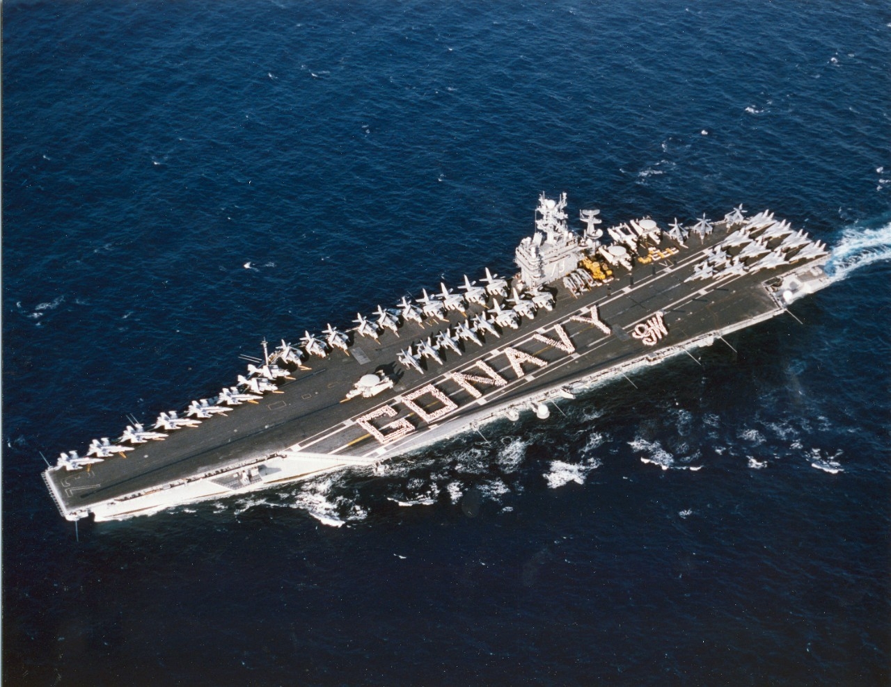 USS George Washington (CVN-73) spelled out “Go Navy”