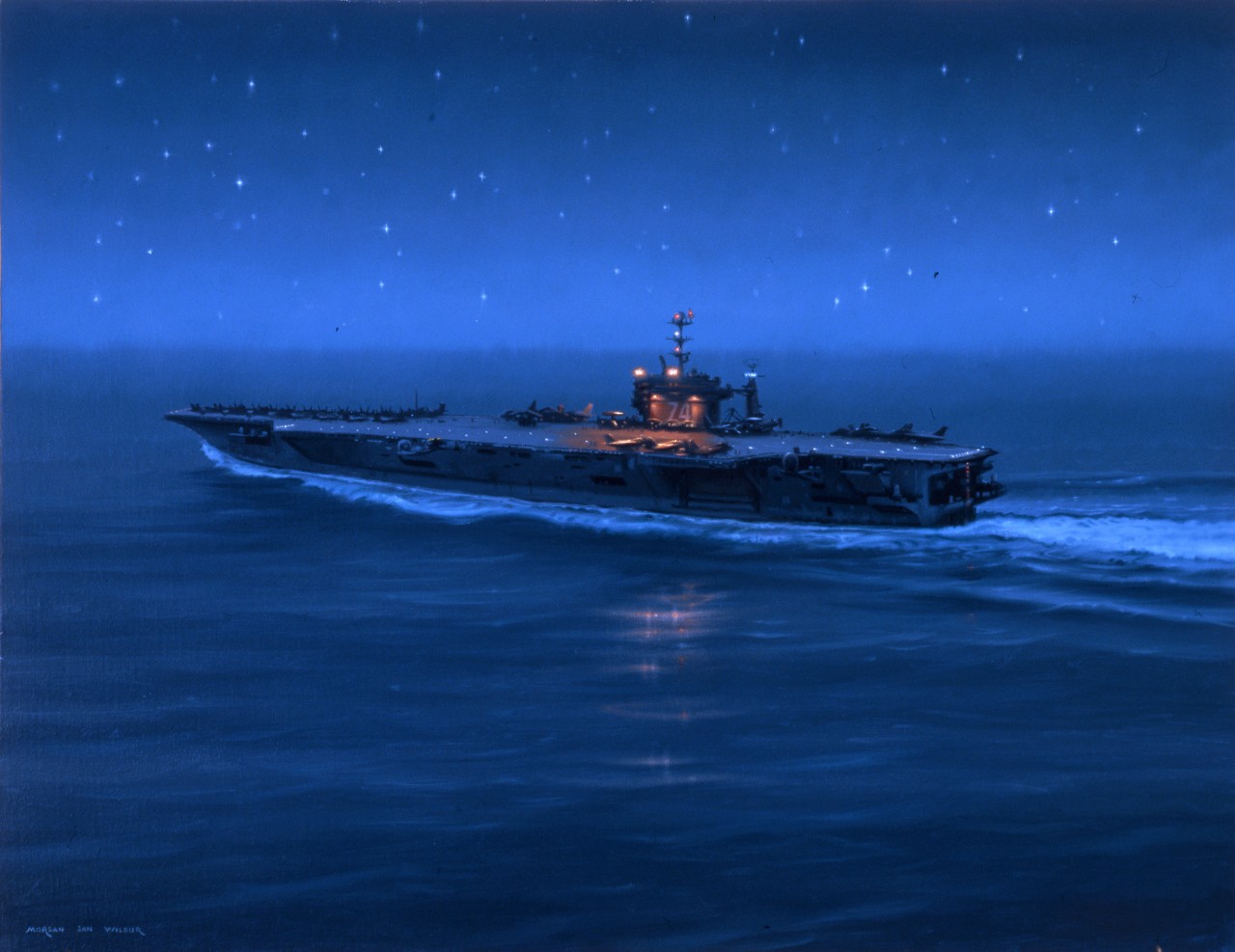 An aircraft carrier at night