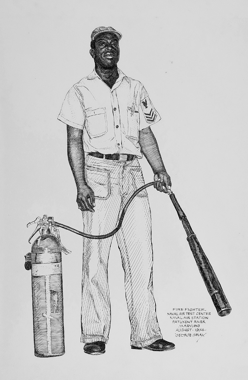 An African American sailor holding a fire extinguisher