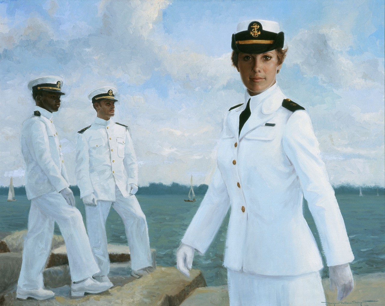 A female midshipman on the left side two male midshipmen standing on the seawall the closer one is African American